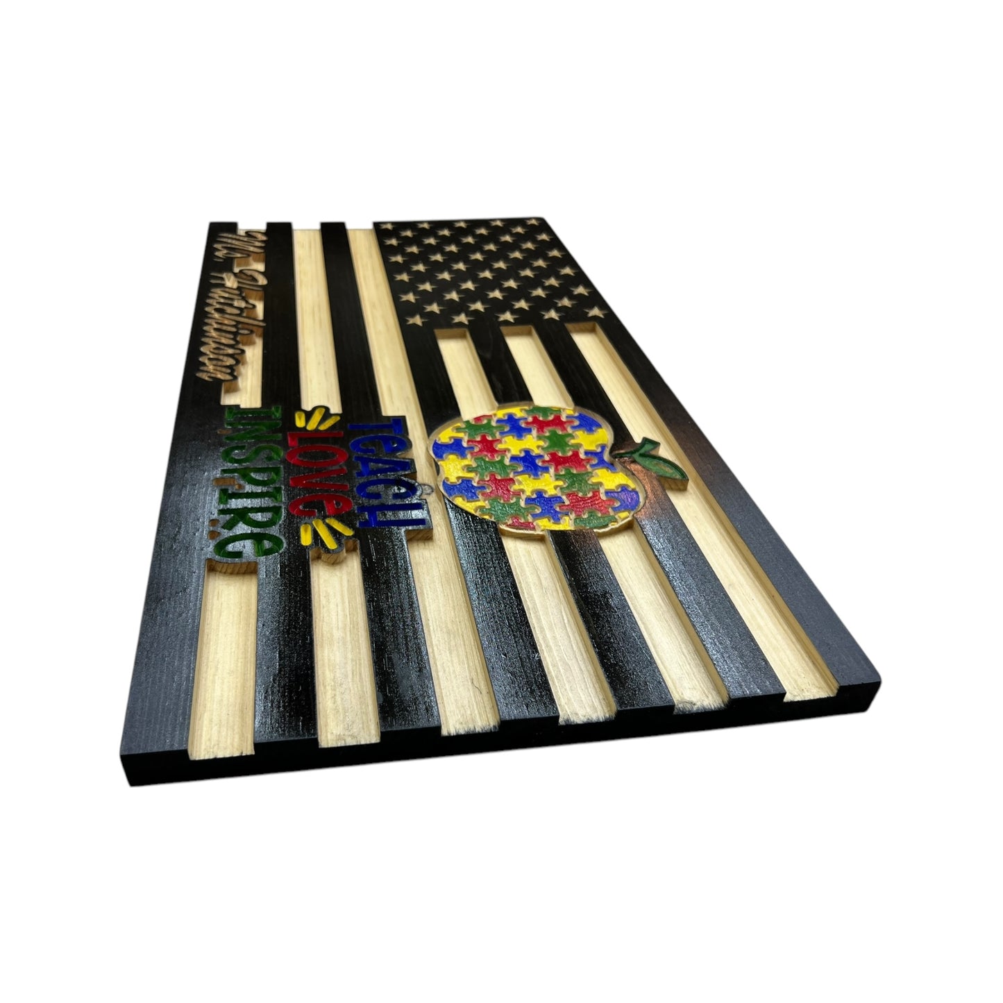 side view of wooden american flag with teach love inspire engraving and personalization