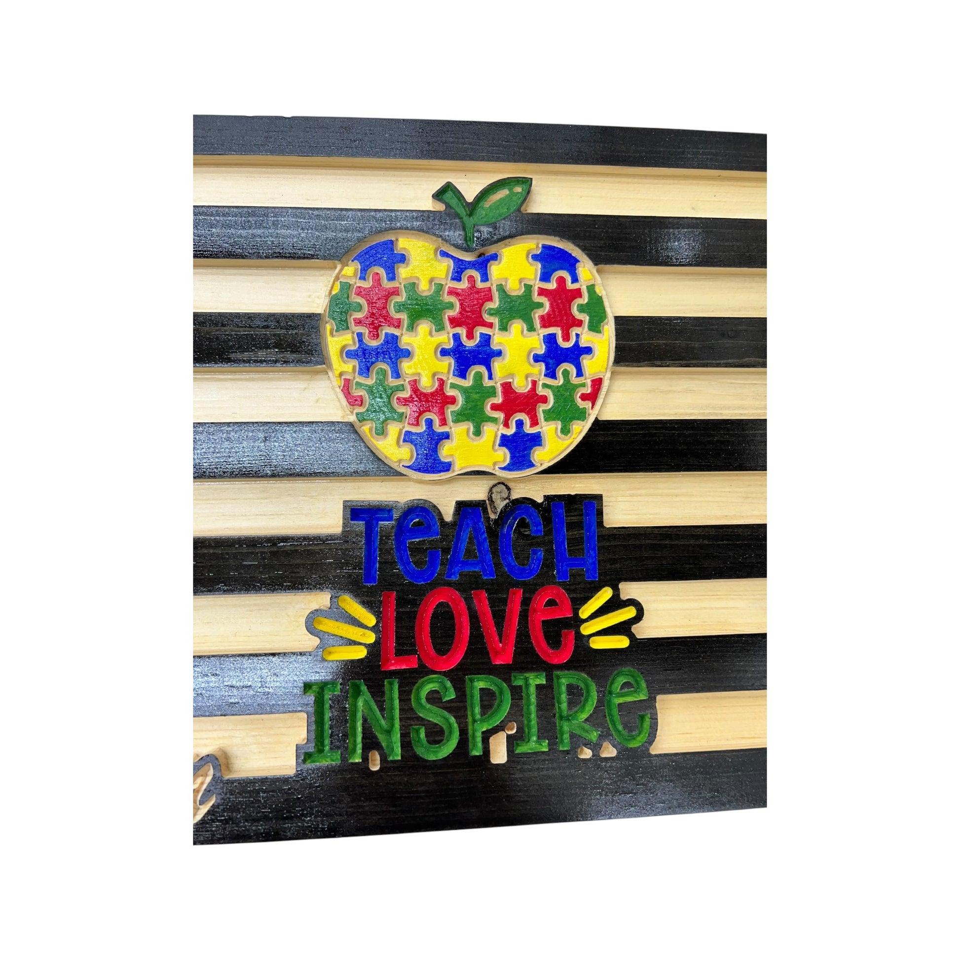apple with puzzle pieces and love teach inspire engraving