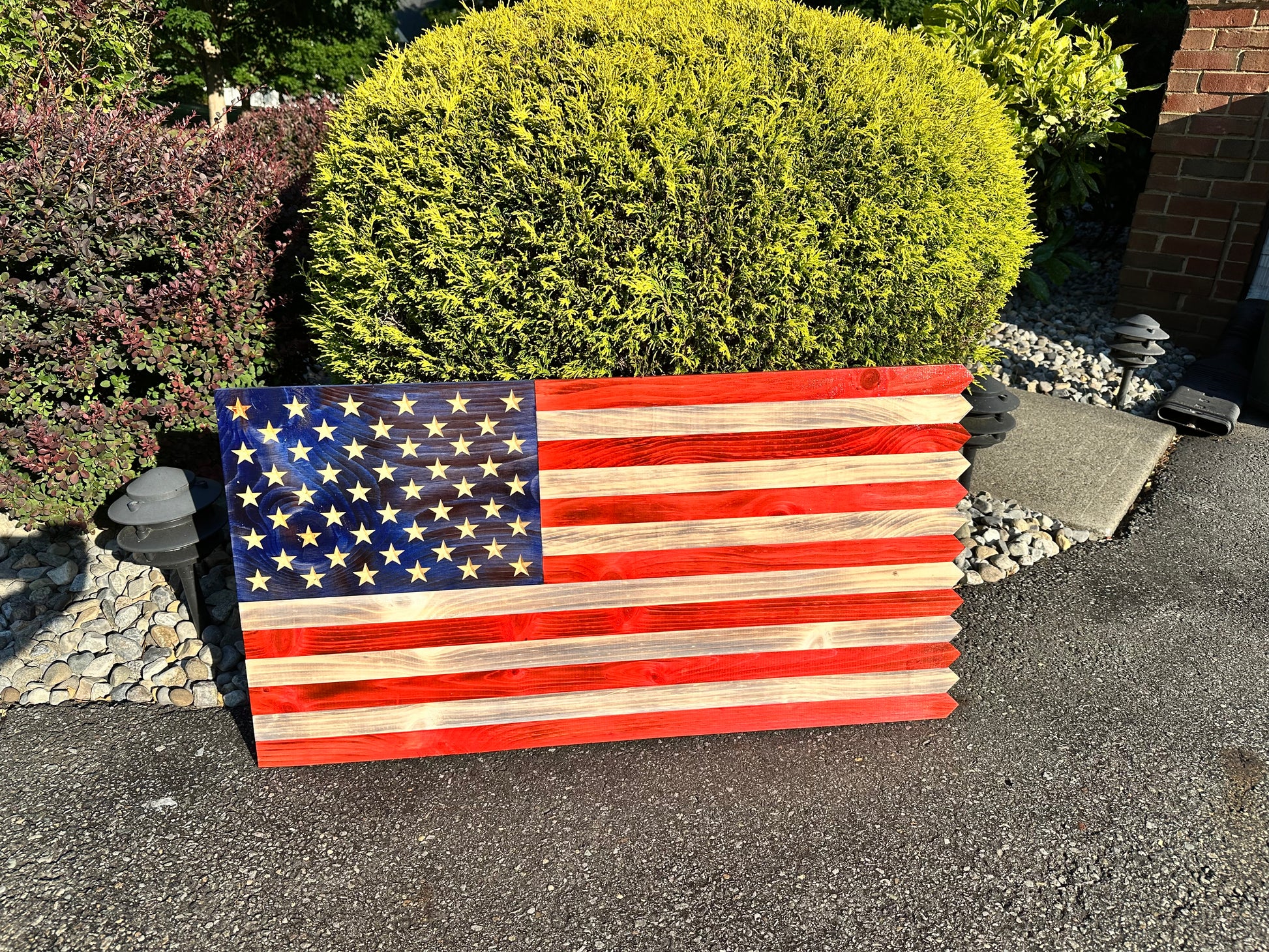wooden american flag with picket fence edge and engraved personalization