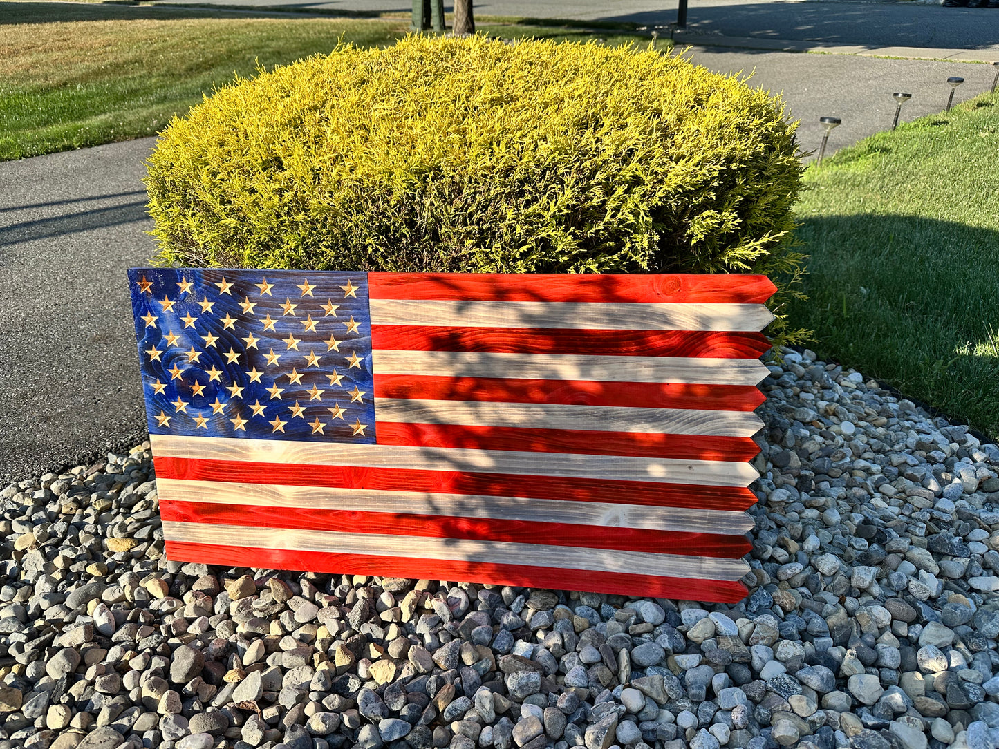 wooden american flag with picket fence edge and engraved personalization 