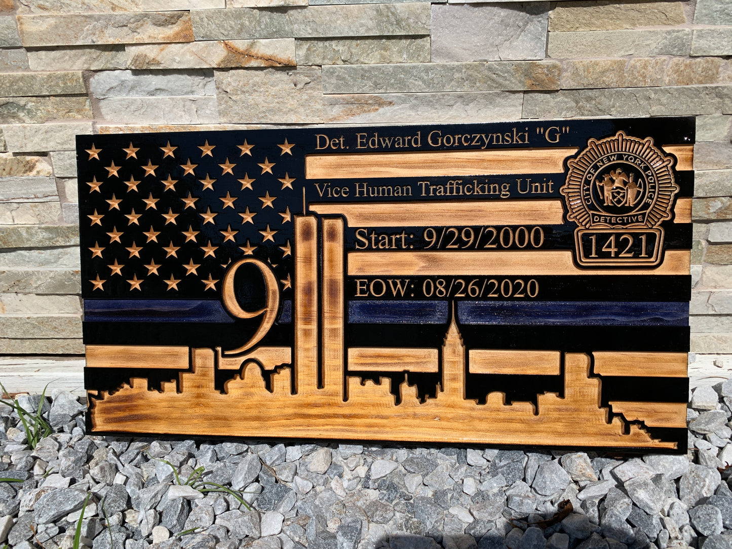 wooden american flag with nyc skyline and 9/11 twin towers thin blue line