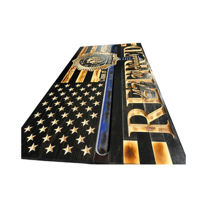 side view of wooden thin blue line american flag with police baton and custom police shield with personalization engraved