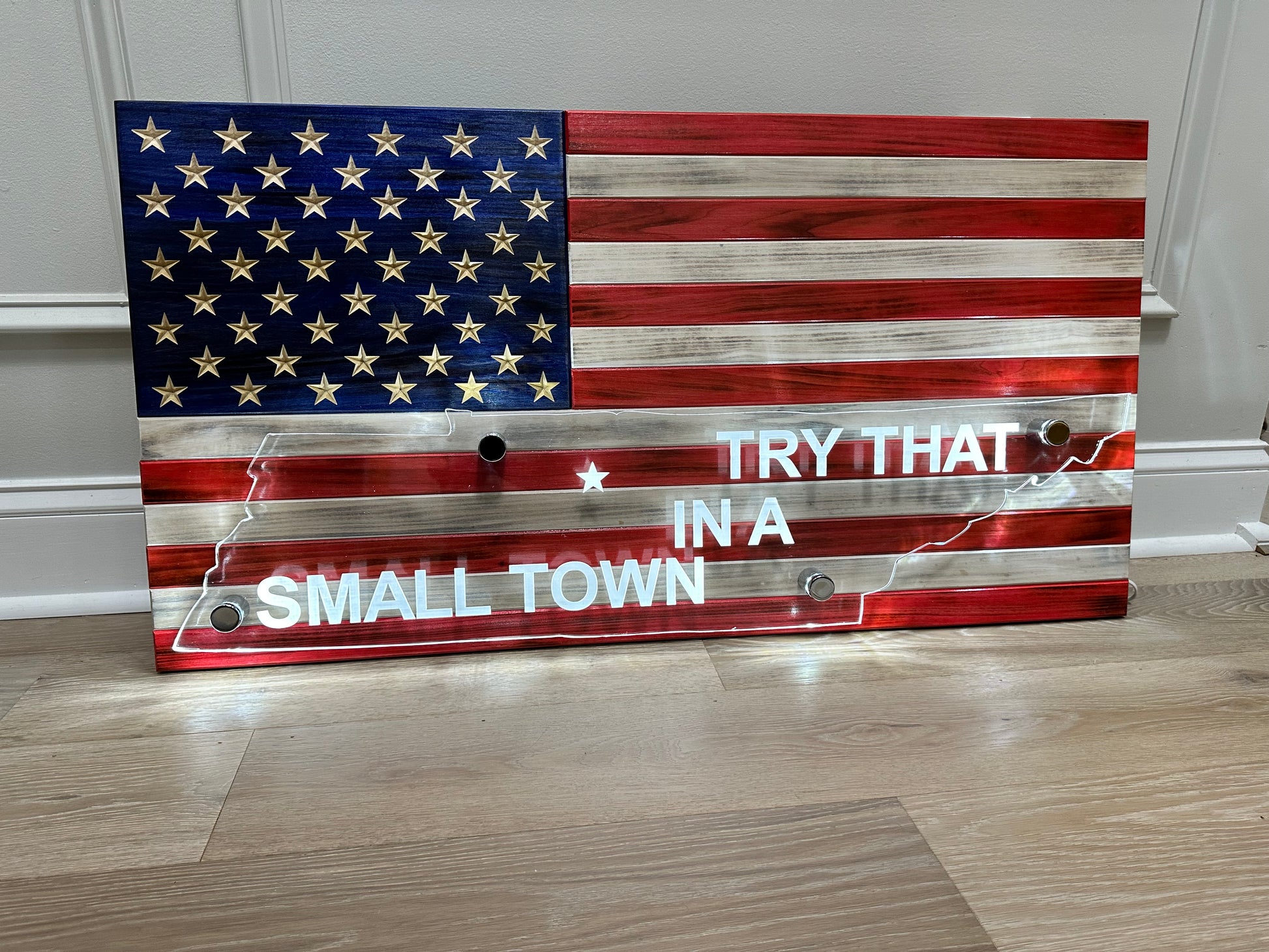 wooden american flag with acrylic cut out of a state and back lit with led lights