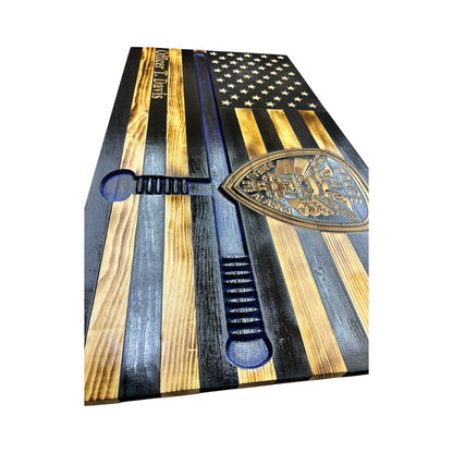 side view of wooden thin blue line american flag with police baton and custom police shield with personalization engraved