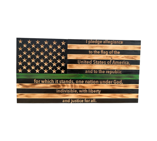 wooden american flag with pledge of allegiance engraving on the stripes