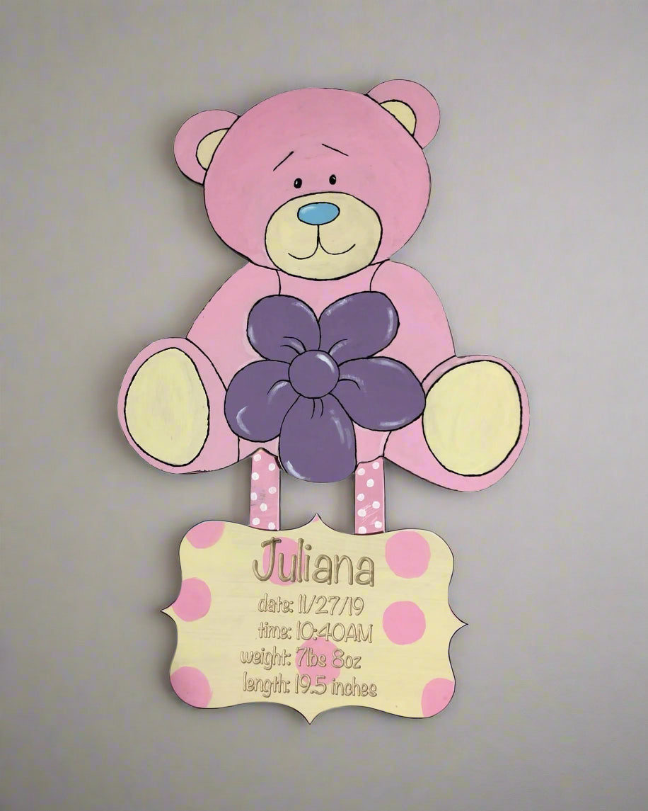 pink teddy bear with a personalized engraving of birth announcement 