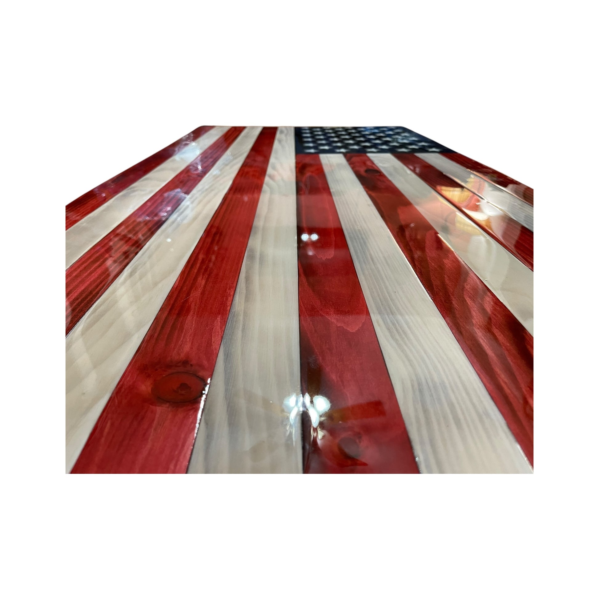 side view of the stripes of red white and blue american flag covered in epoxy