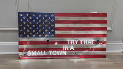 video of wooden american flag with acrylic cut out of a state and back lit with led lights